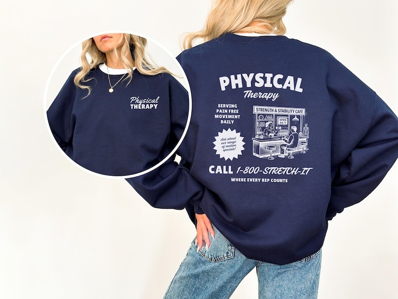 May include: Navy blue sweatshirt with white text that reads "Physical Therapy" on the front and back. The back features a graphic of a cafe scene and the text "Serving Pain Free Movement Daily" and "Call 1-800-STRETCH-IT".