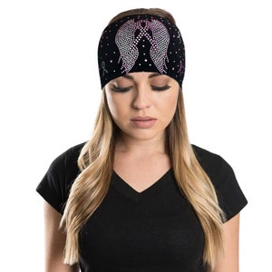 May include: Black headband with a pink ribbon and rhinestone angel wings design.