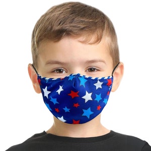 May include: A blue face mask with white and red stars. The mask is made of a soft, breathable fabric and has adjustable ear loops.