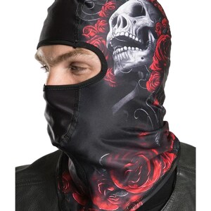 May include: Black balaclava with a skull and red roses design. The skull is white with black eyes and a black mouth. The roses are red with green leaves.