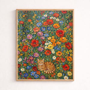 May include: A framed floral painting featuring a ginger tabby cat resting amidst a vibrant field of colorful flowers. The artwork showcases red poppies, daisies, and other blooms in a lush, detailed composition. The frame is a light wood color.