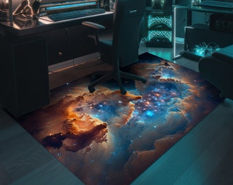 May include: A galaxy-themed rug with a blue, orange, and brown nebula pattern. The rug is placed on a wooden floor in a home office setting.
