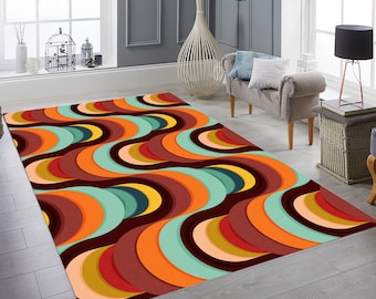 May include: A rectangular area rug with a retro wave pattern in shades of brown, orange, teal, and yellow. The rug is in a living room setting, with a window and furniture visible in the background. The rug is labeled as non-slip, durable, washable, and antibacterial.