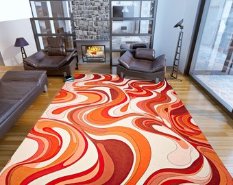 May include: Abstract area rug with a white background and orange, red, and pink swirling patterns.
