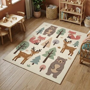 May include: A rectangular area rug with a cream background features cartoon illustrations of woodland animals and trees. The rug includes images of bears, foxes, deer, and various trees in shades of brown, green, and pink.