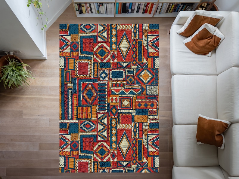 May include: A colorful rug with a geometric pattern in shades of blue, orange, yellow, and red. The rug is made up of a variety of different shapes and sizes, creating a visually interesting design.
