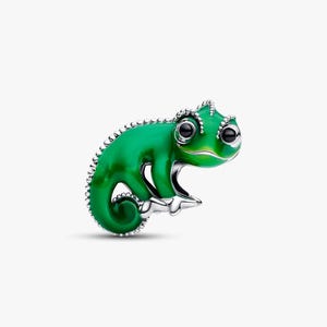 May include: A green chameleon charm with a detailed design. The charm has a shiny, emerald green finish with black eyes and silver accents. The charm is a small, detailed piece of jewellery.