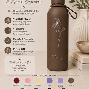 May include: A brown personalised water bottle featuring a daisy flower design and the name "Mary" engraved. The bottle has a screw-on cap and a carrying loop. The text on the bottle says "Birth Flower & Name Engraved".
