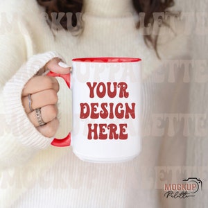May include: White ceramic mug with a red rim and handle. The mug has the text "YOUR DESIGN HERE" in red lettering with a distressed look.