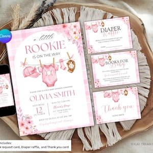 May include: Pink baby shower invitation set with the text "a little Rookie is on the way." Includes invitation, diaper raffle, book request, and thank you cards. The invitation features a baseball theme with a onesie, baseball, and cap.
