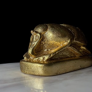 God Apep, Apepi statue with sun disk in form of Egyptian Scarab, The decorative Good luck scarab in Ancient Egypt, Scarab beetle symbol