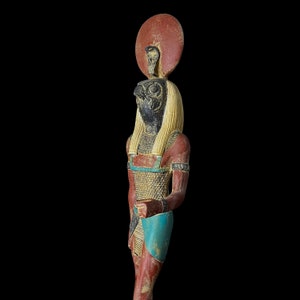 Ancient Egyptian God RA statue, God of the sun, God Ra God of the Sky. God Ra with Sun disk.
