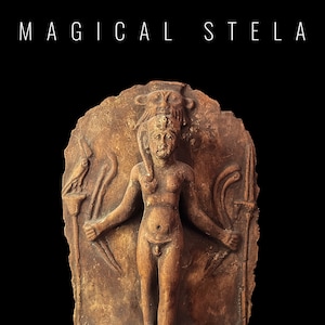 May include: A terracotta stele with a relief carving of a female figure with a crown and a bird on each side. The stele is brown and has a rough texture.