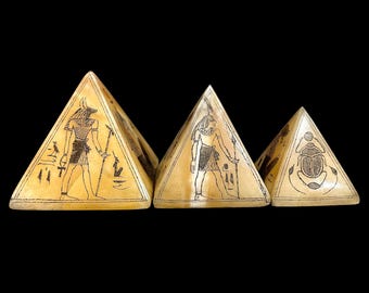 Egyptian Giza pyramids with the inscriptions of Scarab beetle and God Anubis and Ancient Gods.
