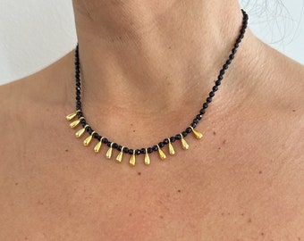 Black onyx gemstones ended with gold filled (on sterling silver) drops