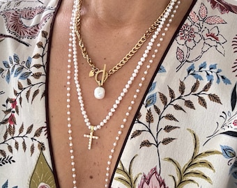 Pearl necklace ended with a gold filled (on sterling silver) cross pendant which is covered with mini pearls