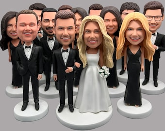 May include: A group of 10 custom-made bobbleheads, including a bride and groom, dressed in formal attire. The bride is wearing a white wedding dress and the groom is wearing a black tuxedo. The other bobbleheads are wearing various outfits, including suits, dresses, and tuxedos.