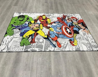 May include: A rectangular area rug featuring a colorful comic book print of Marvel superheroes including Hulk, Wolverine, Iron Man, Spider-Man, Captain America, and Thor. The background consists of black and white comic panels with text.