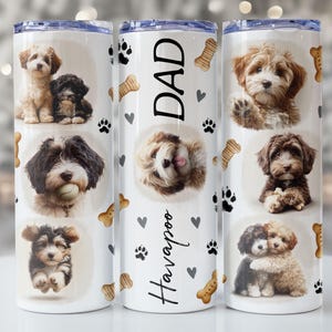May include: White insulated tumbler featuring multiple images of adorable Havanese puppies, paw prints, hearts, and dog bone graphics. The center tumbler has the word "DAD" and "Havapoo" in black script.