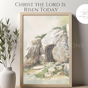 May include: A watercolor painting of a stone tomb with a large stone rolled away, depicting the resurrection of Jesus Christ. The painting is framed in a light wood frame. The text "Christ the Lord is Risen Today" is written above the painting.