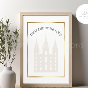 Op de afbeelding: Een afdrukbare kunstprint met een gouden lijst en een witte achtergrond. De print toont een silhouet van een tempel met de tekst "The House of the Lord" in een gouden lijst.
