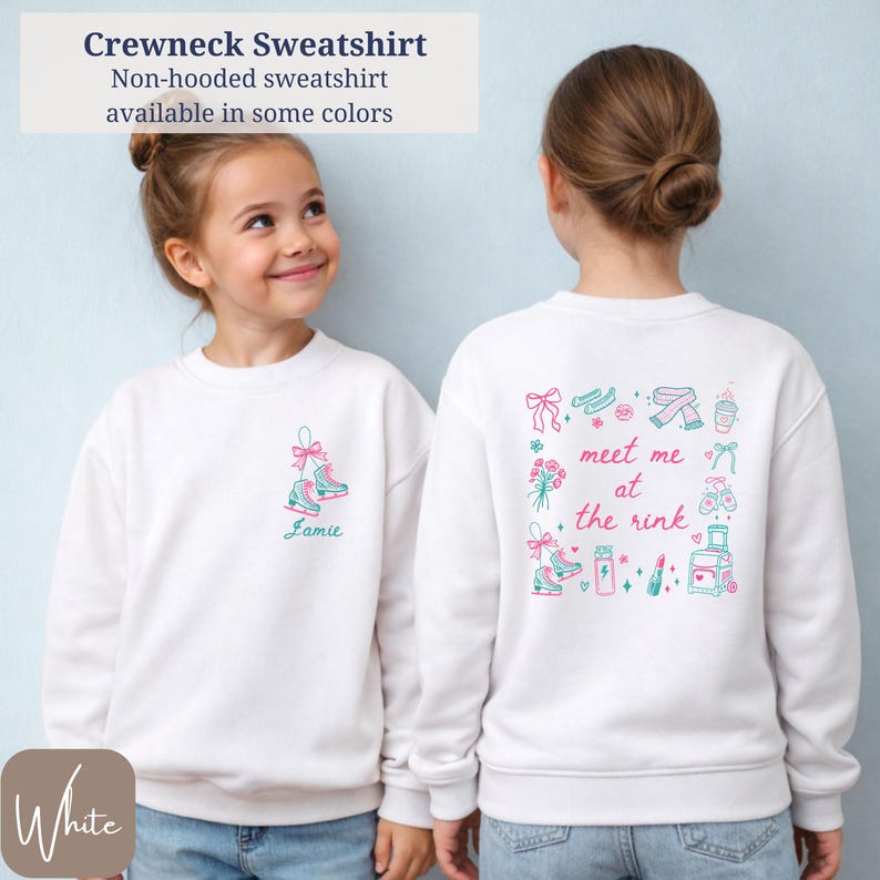 May include: White crewneck sweatshirt with ice skate graphic and the name "Jamie" in teal. The back features a "meet me at the rink" design with ice skates, bows, and other illustrations. The sweatshirt is non-hooded.