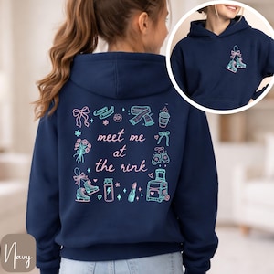 May include: Navy blue hoodie with a graphic design on the back that includes ice skates, a scarf, and the text "meet me at the rink." The front of the hoodie has a small graphic of ice skates. The hoodie is a pullover style.