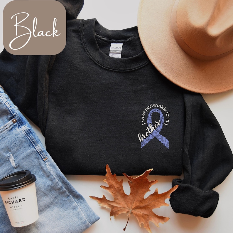 May include: Black sweatshirt with a purple ribbon and the text "I wear periwinkle for my brother".