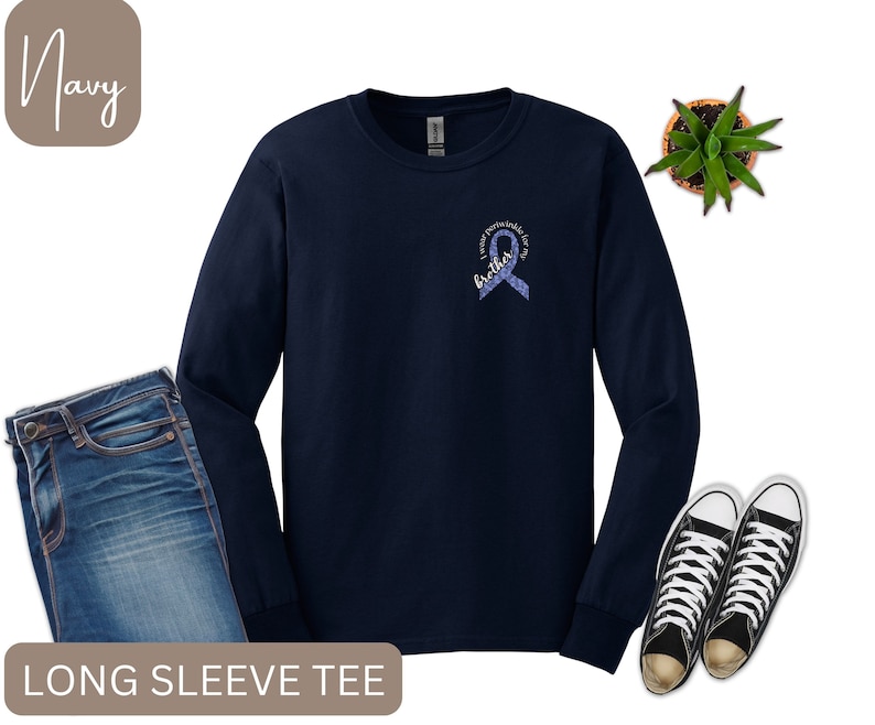 May include: Navy blue long-sleeve t-shirt with a purple ribbon and the text "I wear purple for my brother".