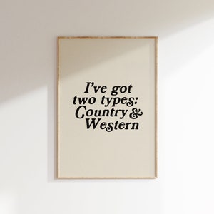 May include: A beige framed print with black text that reads "I've got two types: Country & Western".