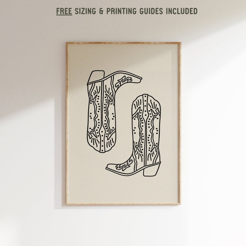 May include: Line art print of two cowboy boots with intricate designs. The boots are black on a beige background.