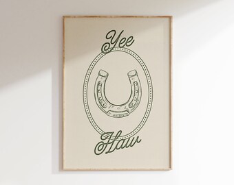 May include: A framed print with a green horseshoe in a circle with the words "Yee Haw" above and below the horseshoe.
