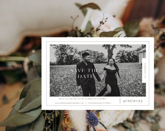 May include: Black and white save the date card with a photo of a couple holding hands in a field. The text "Save the Date" is in a modern font. The date "9/21/2023" is printed in the bottom right corner.