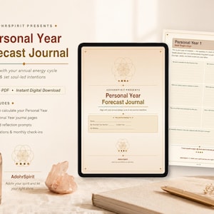 May include: A digital tablet and printed journal display the "Personal Year Forecast Journal" by AdohrSpirit. The journal, designed to align with annual energy cycles, includes pages for personal reflection, affirmations, and monthly check-ins. The design features a soft, neutral color palette.