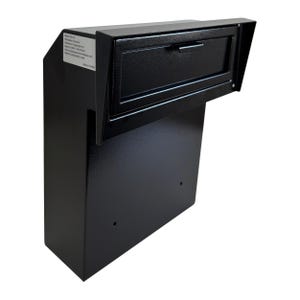May include: A black, wall-mounted mailbox with a rectangular design. The mailbox features a small, hinged door with a handle and a protective overhang. The surface has a slightly textured finish.