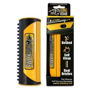 May include: A yellow and black King Komb self-cleaning grooming tool for medium to large dogs. The tool features dual bristles and the text "DeShed", "Self Clean", and "Dual Bristles". The packaging includes the text "The Ultimate Self Cleaning Grooming and De-Shedding Tool".