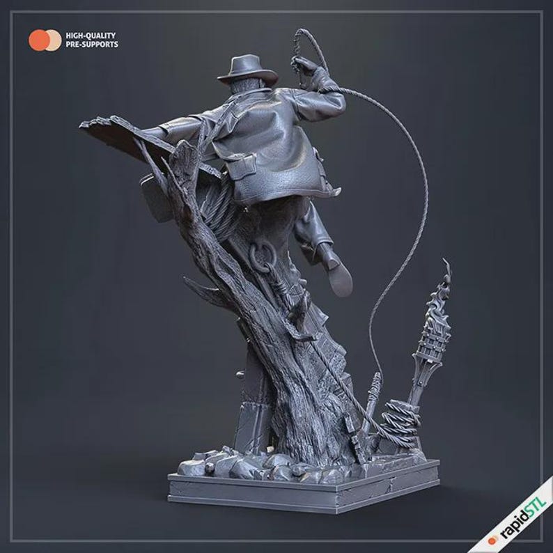 May include: A gray figurine of an adventurer in a fedora and leather jacket, mid-action with a whip. The figure is mounted on a stylized tree trunk base, with the text "HIGH-QUALITY PRE-SUPPORTS" visible. The base also has the "rapidSTL" logo.
