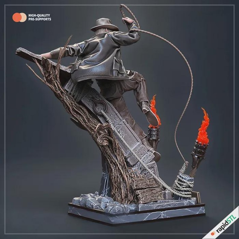 May include: A detailed statue of an adventurer in a fedora and leather jacket, swinging a whip. The figure is posed mid-action, atop a stone structure with torches and a tree branch. The text "HIGH-QUALITY PRE-SUPPORTS" is visible.