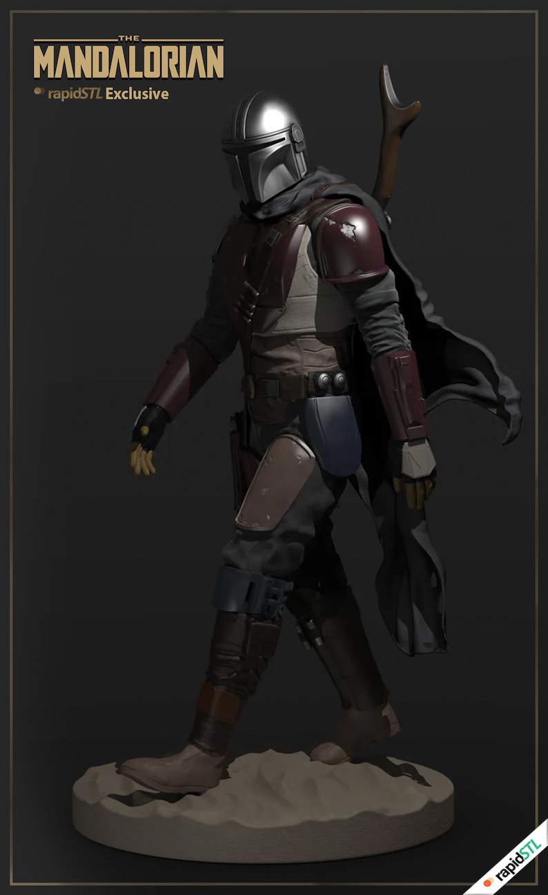 May include: A 3D printed model of The Mandalorian from the Star Wars series. The figure is wearing a silver helmet and dark brown armor with a blue and brown cape. The figure is standing on a sandy base.