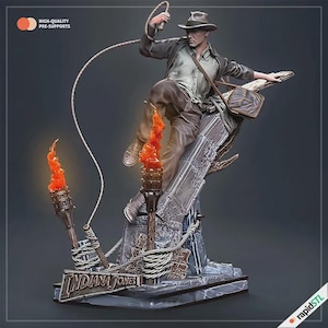 May include: A detailed figurine of Indiana Jones in a dynamic pose, holding a whip and leaping over a stone structure. The figure is dressed in a brown hat, jacket, and pants. Two torches with orange flames flank the figure. The base reads "INDIANA JONES".
