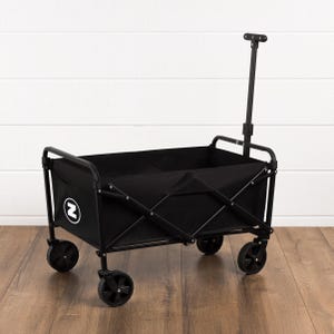 May include: A black folding utility wagon with a black fabric interior and a black metal frame. The wagon has four black wheels and a pull handle. A white circle with a black "N" is on the side.