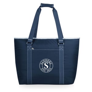 May include: Navy blue tote bag with white stitching and a white trim. The bag has a front pocket and two handles. The bag features the text "SANDERS EST. 2021" in a circular design with the letter "S" in the center.