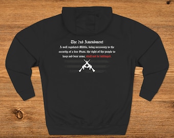 May include: Black hooded sweatshirt with a white print of the 2nd Amendment of the US Constitution. The text reads "The 2nd Amendment. A well regulated Militia, being necessary to the security of a free State, the right of the people to keep and bear arms, shall not be infringed."
