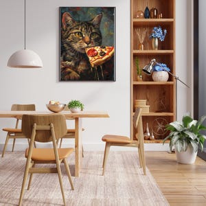Framed Wall Art of Brown Tabby Cat eating a slice of pizza in a kitchen setting