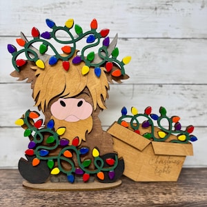 Highland Cow Christmas Wall Decor – Laser Cut Rustic Farmhouse Sign – Wooden Holiday Cow Ornament with Festive Lights