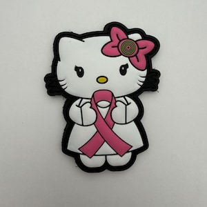 May include: A white cartoon cat with a pink bow and a pink ribbon. The cat has black eyes, whiskers, and a black outline. The ribbon is held in the cat's paws.