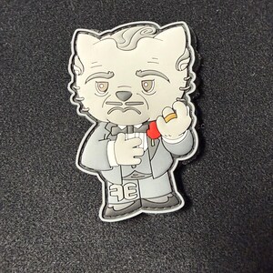 May include: A cartoon cat character wearing a gray suit, bow tie, and holding a ring. The cat has a stern expression and is set against a dark background. The number "36" is visible on the cat's shoe.
