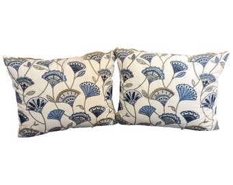 Blue and white floral with fringe trim in the pattern pillows