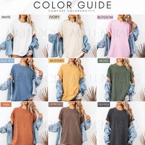 May include: Color guide for t-shirts in various colors, including white, ivory, blossom, blue jean, mustard, moss, yam, espresso, and pepper. The t-shirts are shown on models wearing denim jackets.