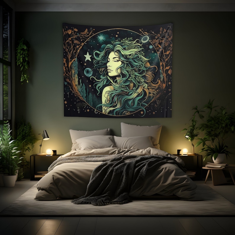 May include: A tapestry featuring a woman with long green hair and a crown of leaves, surrounded by a circle of stars and planets. The tapestry is set against a dark background with a green and gold color scheme.